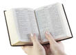 hand holds the bible