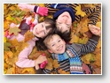 Children in autumn leaves